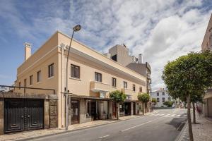 a building on a street with a street light at Ovar Apartments by Aqualeisure in Ovar