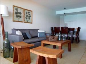 a living room with a couch and a table at San Alfonso del Mar Ed Crucero in Algarrobo