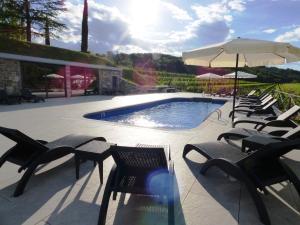 Bazén v ubytovaní Il Roncal Wine Resort - for Wine Lovers alebo v jeho blízkosti