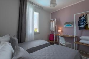 Postel nebo postele na pokoji v ubytování Calura Residence