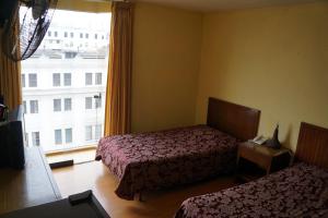 Cama o camas de una habitación en Hotel El Plaza Centro de Lima