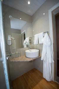 a bathroom with a sink and a mirror at Hotel Drim in Struga