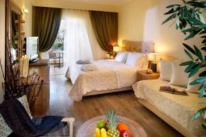 Postel nebo postele na pokoji v ubytování Portes Beach Hotel