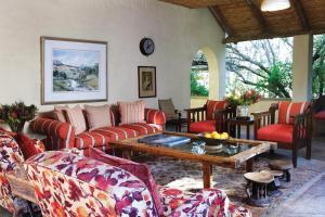 a living room with couches and a coffee table at Elephant House in Addo