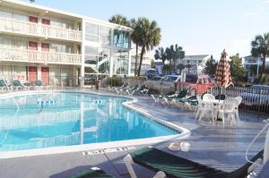 a swimming pool in front of a hotel at Oceanfront Viking Motel in Myrtle Beach