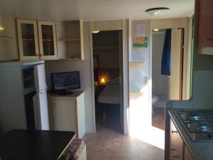 A kitchen or kitchenette at Villaggio Camping Europa