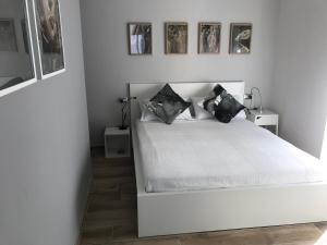 Postel nebo postele na pokoji v ubytování B&B Quasi in centro