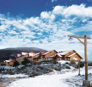 a small town with a couple of houses on top of it at Los Cauquenes Resort + Spa + Experiences in Ushuaia