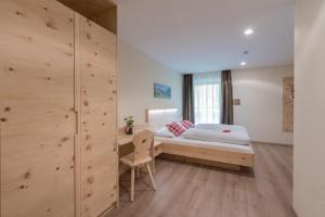 Voodi või voodid majutusasutuse Hotel Alpenrast toas