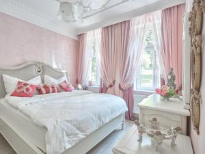 Ліжко або ліжка в номері Apart House Plesia