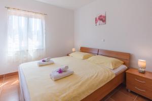 Cama o camas de una habitación en Apartments Šimić