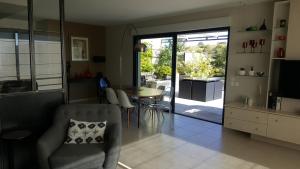 a living room with a table and a dining room at Les Toits De Vaison in Vaison-la-Romaine