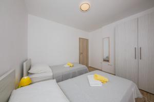 Кровать или кровати в номере Apartments MARE
