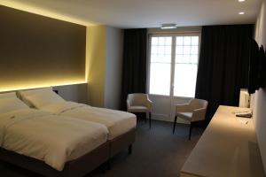 Postel nebo postele na pokoji v ubytování Hotel Astel