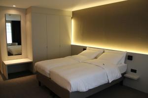 Postel nebo postele na pokoji v ubytování Hotel Astel