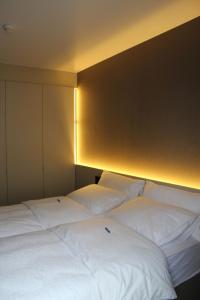 Postel nebo postele na pokoji v ubytování Hotel Astel