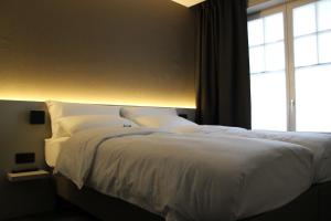 Postel nebo postele na pokoji v ubytování Hotel Astel
