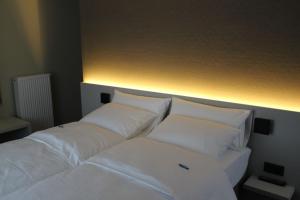 Postel nebo postele na pokoji v ubytování Hotel Astel