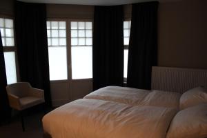 Postel nebo postele na pokoji v ubytování Hotel Astel