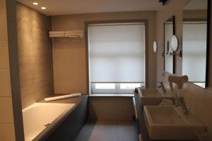 Postel nebo postele na pokoji v ubytování Hotel Astel