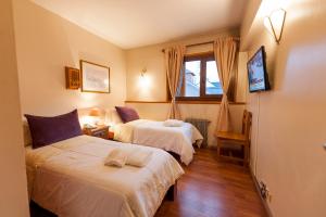 Postel nebo postele na pokoji v ubytování Tunqueley Hotel