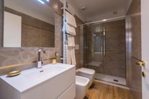 a bathroom with a toilet and a sink and a shower at Ca' Dorè in Venice