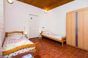 Łóżko lub łóżka w pokoju w obiekcie Apartment Sina