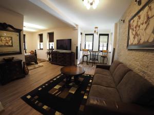 a living room with a couch and a table at Guest house DON-lux in Pljevlja