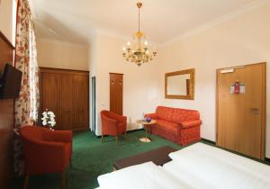 Postel nebo postele na pokoji v ubytování Hotel Grünwald