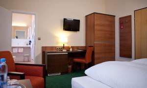 Postel nebo postele na pokoji v ubytování Hotel Grünwald