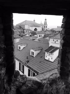 a black and white photo of a building with a roof at Al Castello Affittacamere in Pietra Ligure