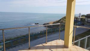 a view of the ocean from a balcony at The Yellow House in Ahtopol