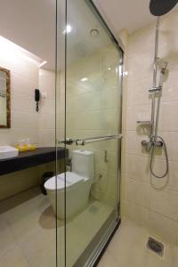 A bathroom at Hotel H - Sandhill Hotels Private Limited