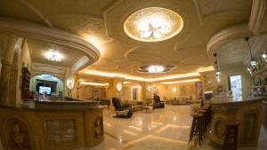 a lobby with a bar in a building at Aphrodite Hotel in Laganas