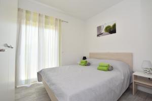Cama ou camas em um quarto em Apartmani Iva&Ante