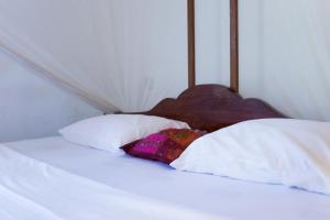 Voodi või voodid majutusasutuse Lazy Beach House toas