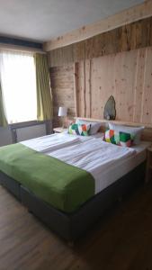 Кровать или кровати в номере Hotel & Auberge le Journal