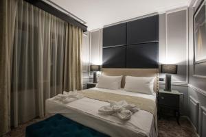 Postel nebo postele na pokoji v ubytování Peninsula Boutique Hotel
