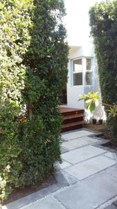 a stone walkway leading to a house with a bench at B's Place in Port Elizabeth