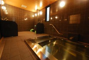 a bathroom with a tub in the middle of the room at 高野山 宿坊 増福院 -Koyasan Shukubo Zofukuin- in Koyasan +34 photos