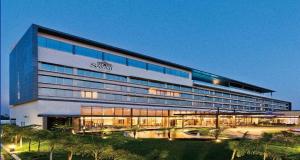 a large building with a sign on the side of it at Sayaji Raipur in Raipur