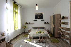 a room with a bed with flowers on it at Central Park Apartments in Cluj-Napoca