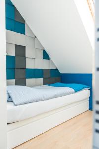 Posteľ alebo postele v izbe v ubytovaní Apartament Rewa