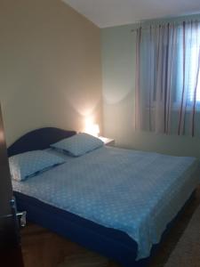 Postel nebo postele na pokoji v ubytování Apartment Ivo
