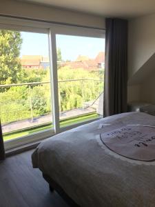 Postel nebo postele na pokoji v ubytování B&B Intermezzo