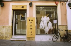 a store window with a bike parked in front of it at Hotel La Milagrosa in Alicante