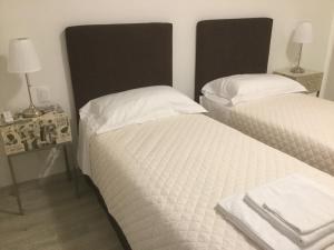 Postel nebo postele na pokoji v ubytování Dimora 16 Rooms & Garden