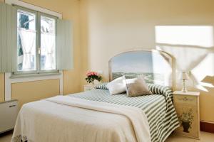A bed or beds in a room at Poderi Arcangelo
