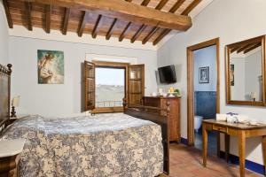 A bed or beds in a room at Poderi Arcangelo