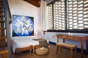 A bed or beds in a room at Poderi Arcangelo